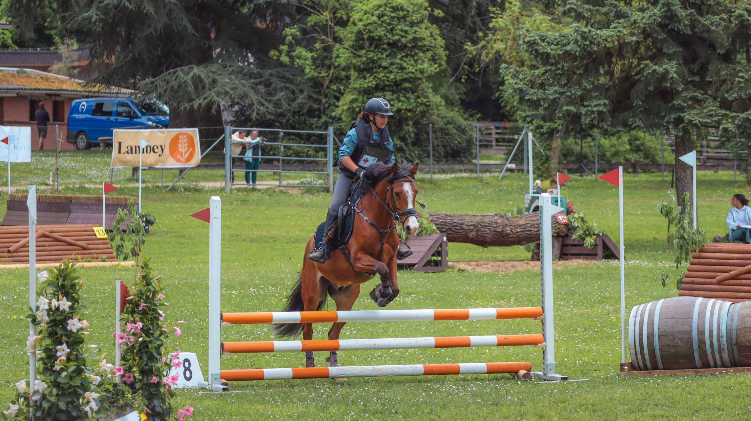 woman in white long sleeve shirt and brown skirt sitting on brown rock during daytime